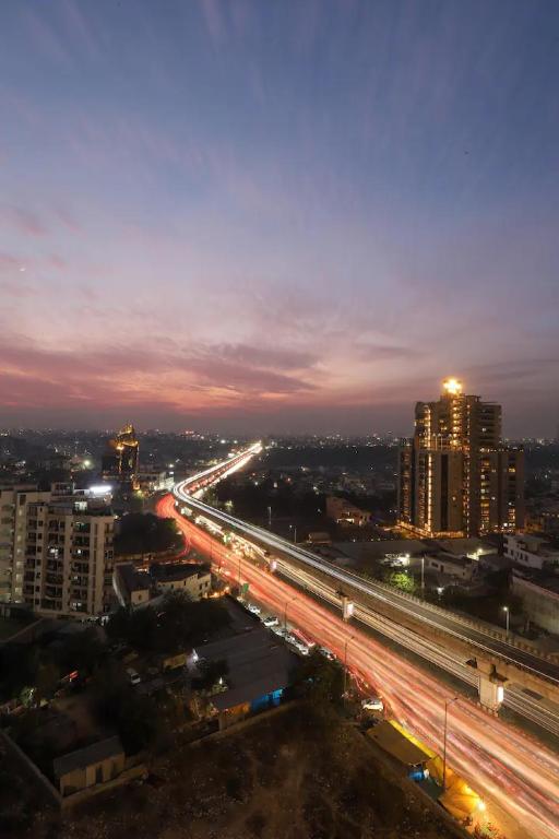 a city at night with traffic on a freeway at The Grand Anukampa Oasis in Jaipur